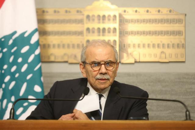 A photograph released by the Lebanese government press office on December 19, 2025 show Lebanon's Prime Minister speaking during a press conference in Beirut. Lebanese Prime Minister Nawaf Salam published on December 19 a long-awaited banking draft bill, which would distribute losses from the 2019 financial crisis between banks and the state. In a televised speech, Salam said "this draft law constitutes a roadmap to getting out of the crisis" that still grips Lebanon. The bill is one of the reforms demanded by the international community before Beirut can receive financial support. (Photo by HANDOUT / Lebanese Government Press Office / AFP)
