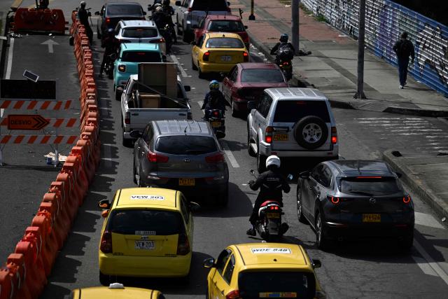 Vehicles are seen during a traffic jam in Bogota on December 19, 2025. (Photo by Pablo VERA / AFP)