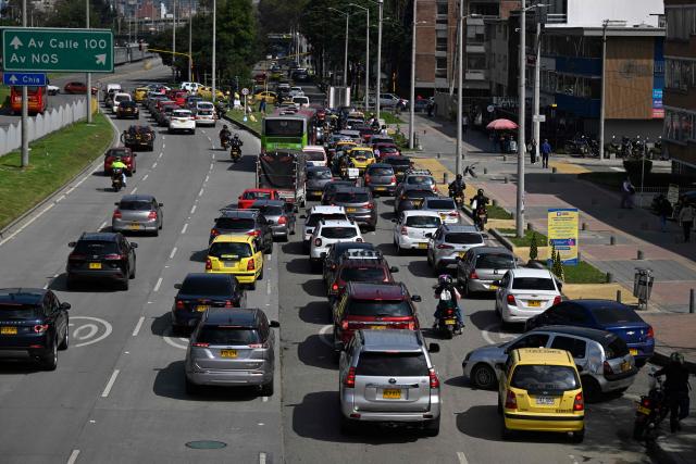 Vehicles are seen during a traffic jam in Bogota on December 19, 2025. (Photo by Pablo VERA / AFP)