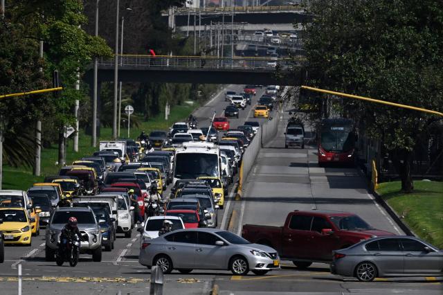 Vehicles are seen during a traffic jam in Bogota on December 19, 2025. (Photo by Pablo VERA / AFP)