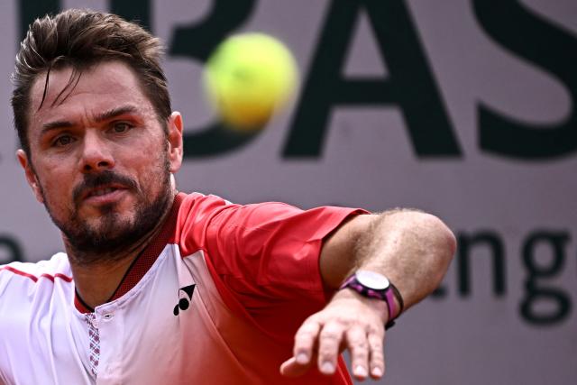 (FILES) Switzerland's Stan Wawrinka eyes the ball during his men's singles match against Great Britain's Jacob Fearnley on day 2 of the French Open tennis tournament at the Roland-Garros Complex in Paris on May 26, 2025. Stan Wawrinka says the 2026 season will be his last as the three-time Grand Slam singles champion aims to finish his career "on the best note possible". "Every book needs an ending. It's time to write the final chapter of my career as a professional tennis player. 2026 will be my last year on tour," Wawrinka posted on December 19, 2025, on social media. (Photo by JULIEN DE ROSA / AFP)