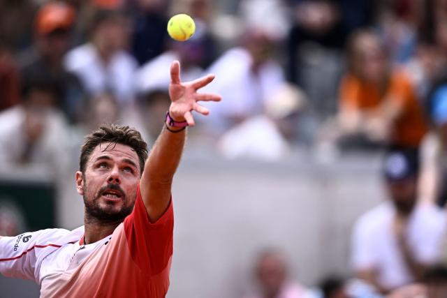 (FILES) Switzerland's Stan Wawrinka serves to Great Britain's Jacob Fearnley during their men's singles match on day 2 of the French Open tennis tournament at the Roland-Garros Complex in Paris on May 26, 2025. Stan Wawrinka says the 2026 season will be his last as the three-time Grand Slam singles champion aims to finish his career "on the best note possible". "Every book needs an ending. It's time to write the final chapter of my career as a professional tennis player. 2026 will be my last year on tour," Wawrinka posted on December 19, 2025, on social media. (Photo by JULIEN DE ROSA / AFP)