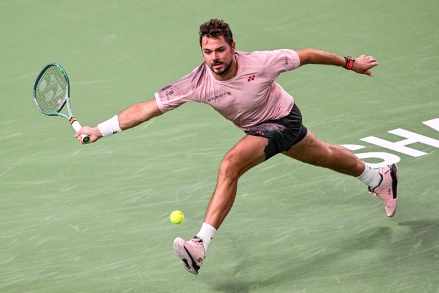 (FILES) Switzerland's Stan Wawrinka hits a return to France's Giovanni Mpetshi Perricard during their men's singles match at the Shanghai Masters tennis tournament in Shanghai on October 3, 2024. Stan Wawrinka says the 2026 season will be his last as the three-time Grand Slam singles champion aims to finish his career "on the best note possible". "Every book needs an ending. It's time to write the final chapter of my career as a professional tennis player. 2026 will be my last year on tour," Wawrinka posted on December 19, 2025, on social media. (Photo by Hector RETAMAL / AFP)