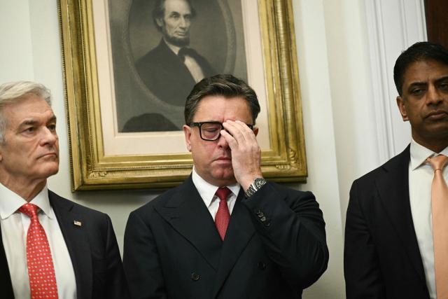 (L-R) Dr. Mehmet Oz, administrator of the Centers for Medicare and Medicaid Services, Sanofi CEO Paul Hudson and Novartis CEO Vasant Narasimhan look on as US President Donald Trump makes an announcement on lowering drug prices from the Roosevelt Room of the White House in Washington, DC, on December 19, 2025. (Photo by Brendan SMIALOWSKI / AFP)