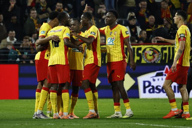 RC Lens celebrates after Lens’ Saudi Arabian defender #2 Saud Abdulhamid scored a goal during the French Cup (Coupe de France) round of 64 football match between RC Lens and Feignies-Aulnoye at the Stade Bollaert-Delelis stadium in Lens, northern France, on December 19, 2025. (Photo by Simon Wohlfahrt / AFP)