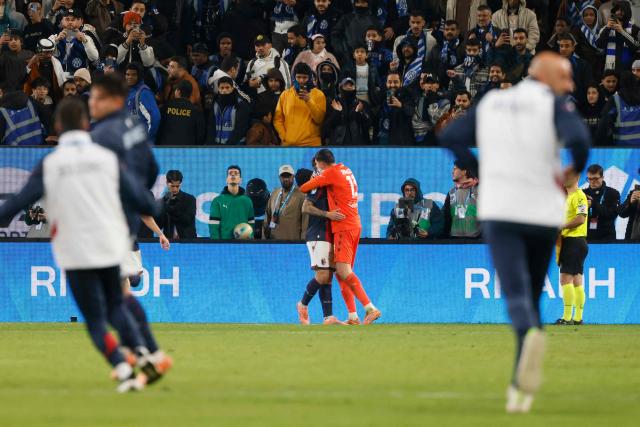 Bologna's players celebrate their win during the Italian Super Cup semi-final match between Inter Milan and Bologna FC 1909 at King Al-Awwal Park Stadium, in Riyadh on December 19, 2025. (Photo by Fayez NURELDINE / AFP)