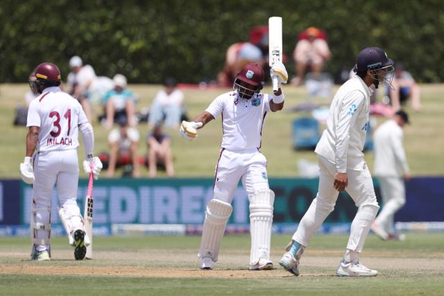 West Indies' Kavem Hodge celebrates 50 runs during day three of the 3rd international Test cricket match between New Zealand and West Indies at Bay Oval in Mount Maunganui on December 20, 2025. (Photo by Michael Bradley / AFP)