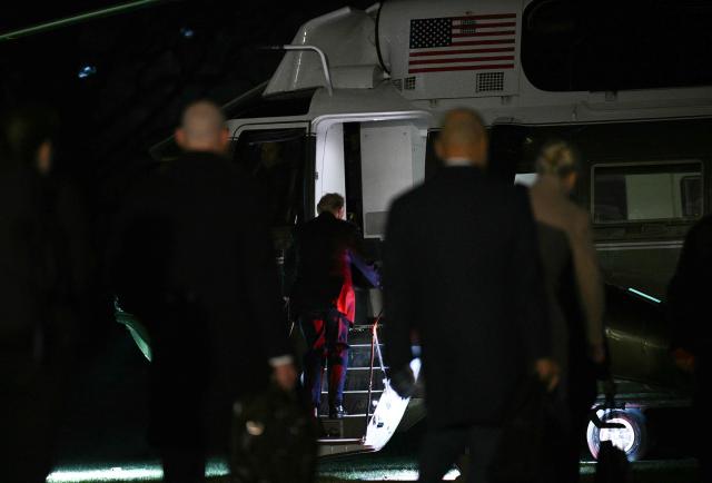 US President Donald Trump boards Marine One as he departs from the South Lawn of the White House in Washington, DC on December 19, 2025. Trump is on his way to Rocky Mount, North Carolina to hold a political rally and speak about the economy. (Photo by Brendan SMIALOWSKI / AFP)