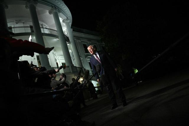 US President Donald Trump speaks to reportes before boarding Marine One as he departs from the South Lawn of the White House in Washington, DC on December 19, 2025. Trump is on his way to Rocky Mount, North Carolina to hold a political rally and speak about the economy. (Photo by Brendan SMIALOWSKI / AFP)