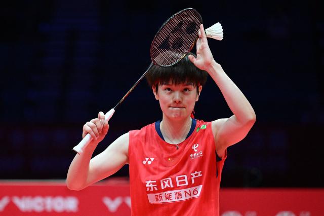 China’s Wang Zhiyi celebrates defeating Thailand’s Ratchanok Intanon in their women's singles semi-final match at the BWF Badminton World Tour Finals at the Hangzhou Olympic Sports Centre Gymnasium in Hangzhou, in eastern China's Zhejiang province on December 20, 2025. (Photo by Jade Gao / AFP)