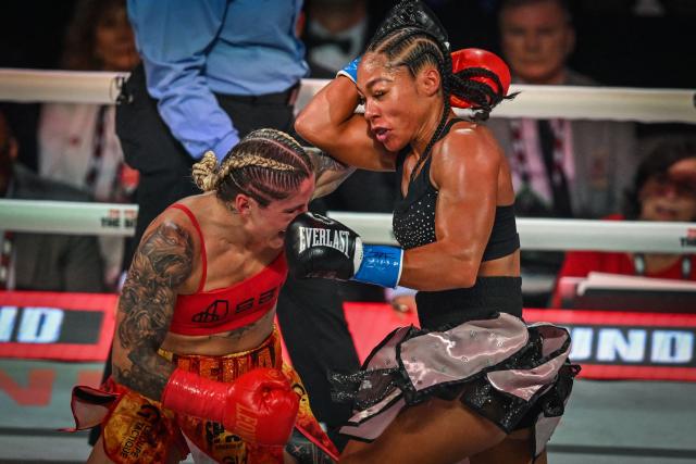 US boxer Alycia Baumgardner (R) fights Canadian boxer Leila Beaudoin in their unified super-featherweight world championship bout on the undercard of the Paul–Joshua non?title heavyweight fight at the Kaseya Center in Miami, Florida, on December 19, 2025. (Photo by Giorgio VIERA / AFP)