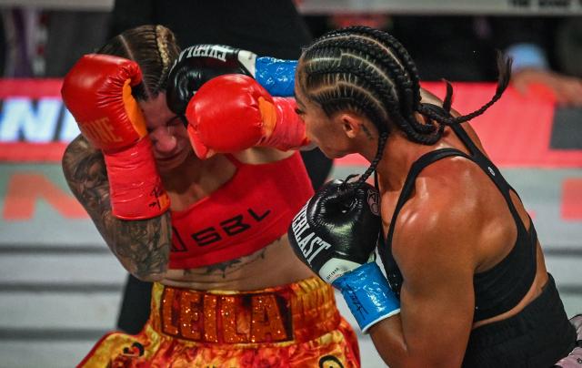 US boxer Alycia Baumgardner (R) fights Canadian boxer Leila Beaudoin in their unified super-featherweight world championship bout on the undercard of the Paul–Joshua non?title heavyweight fight at the Kaseya Center in Miami, Florida, on December 19, 2025. (Photo by Giorgio VIERA / AFP)