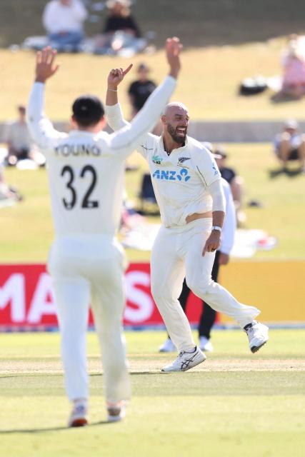 New Zealand’s Daryl Mitchell celebrates the wicket of West Indies Justin Greaves during day three of the 3rd international Test cricket match between New Zealand and West Indies at Bay Oval in Mount Maunganui on December 20, 2025. (Photo by Michael Bradley / AFP)