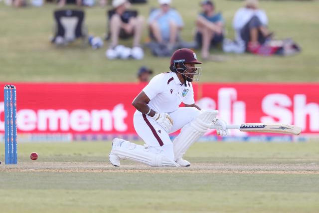 West Indies' Kavem Hodge is hit by the ball during day three of the 3rd international Test cricket match between New Zealand and West Indies at Bay Oval in Mount Maunganui on December 20, 2025. (Photo by Michael Bradley / AFP)