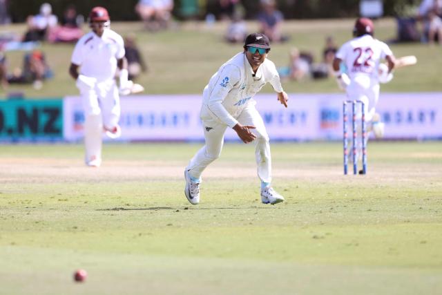 New Zealand’s Rachin Ravindra looks to field the ball during day three of the 3rd international Test cricket match between New Zealand and West Indies at Bay Oval in Mount Maunganui on December 20, 2025. (Photo by Michael Bradley / AFP)