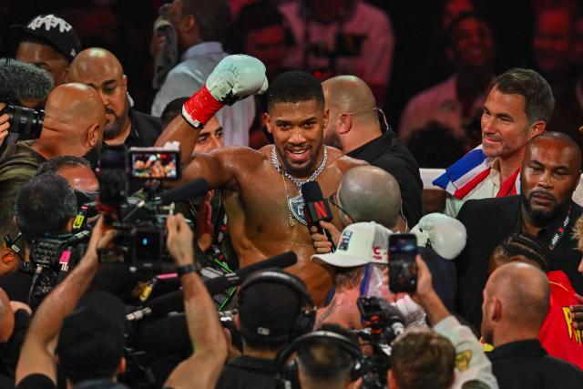 British boxer Anthony Joshua celebrates after defeating US boxer and influencer Jake Paul (off frame) in a non?title heavyweight bout at the Kaseya Center in Miami, Florida, on December 19, 2025. (Photo by Giorgio VIERA / AFP)