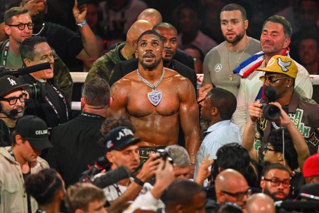British boxer Anthony Joshua celebrates after defeating US boxer and influencer Jake Paul (off frame) in a non-title heavyweight bout at the Kaseya Center in Miami, Florida, on December 19, 2025. (Photo by Giorgio VIERA / AFP)