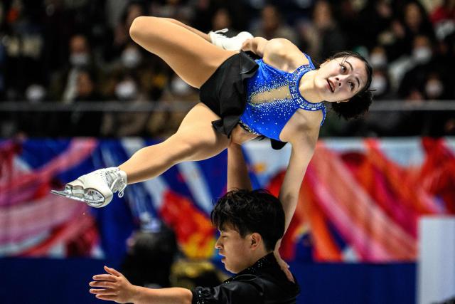 Japan's Ayumi Kagotani and Lucas Tsuyoshi Honda compete in the pairs short program during Japan Figure Skating Championships in Tokyo on December 20, 2025. (Photo by Philip FONG / AFP)