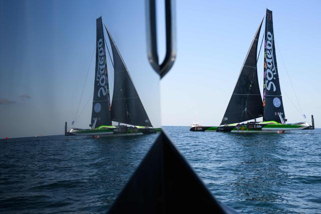 (FILES) French skippers Thomas Coville and Benjamin Schwartz sail the "Sodebo Ultim 3" Ultim multihull during the run stage of the 24H Ultim sailing event in Lorient, on September 26, 2025. Navigator Thomas Coville and his crew, on Sodebo Ultim 3, crossed the equator on december 19, 2025 night, four days, four hours and two minutes after their departure around the world off Ushant, setting a new impressive record on this stretch. (Photo by Loic VENANCE / AFP)