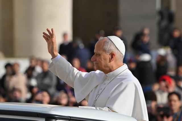 Pope Leo XIV waves to the crowd from his pope-mobile during the Jubilee Audience at St Peter's Square in The Vatican on December 20, 2025. (Photo by Andreas SOLARO / AFP)