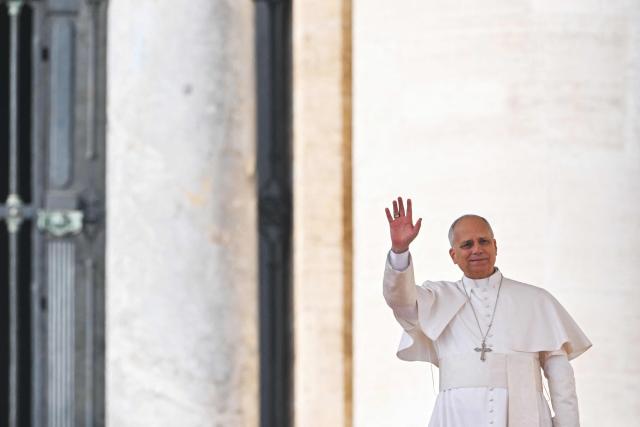 TOPSHOT - Pope Leo XIV waves to the crowd during the Jubilee Audience at St Peter's Square in The Vatican on December 20, 2025. (Photo by Andreas SOLARO / AFP)