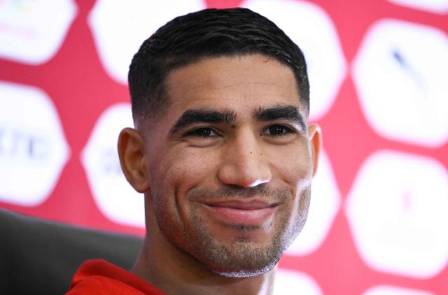 Morocco's defender #02 Achraf Hakimi smiles during a press conference at Prince Moulay Abdellah Stadium in Rabat, Morocco on December 20, 2025, ahead of the start of the Africa Cup of Nations (CAN) football tournament. Morooco take on Comoros in the opening game on December 21. (Photo by SEBASTIEN BOZON / AFP)