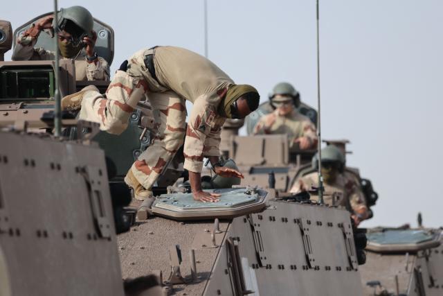 French soldiers from the 5th Tank Regiment train with infantry armoured vehicles at a military field in Zayed Military City, near Abu Dhabi, on December 20, 2025. (Photo by Ludovic MARIN / AFP)
