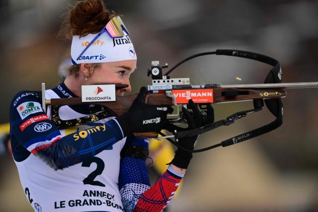 France's Lou Jeanmonnot fires her rifle during the women's 10km pursuit event of the IBU Biathlon World Cup, in Le Grand Bornand, near Annecy, southeastern France, on December 20, 2025. (Photo by Olivier CHASSIGNOLE / AFP)