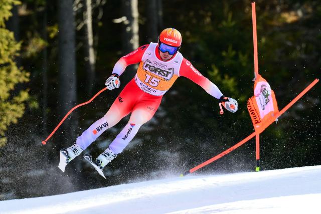 Switzerland's Justin Murisier competes in the men's downhill race part of the FIS Alpine Ski World Cup 2025-2026, in Val Garderna, northern Italy, on December 20, 2025. (Photo by Stefano RELLANDINI / AFP)
