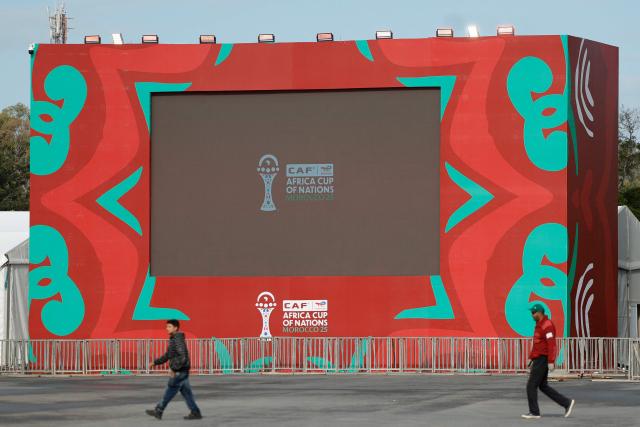 Workers put the finishing touches on the fanzone, in the Souissi district of Rabat, Morocco on December 20, 2025, ahead of the start of the Africa Cup of Nations (CAN) football tournament. Morocco take on Comoros in the opening game on December 21. (Photo by Abdel Majid BZIOUAT / AFP)