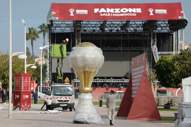Workers put the finishing touches on the fanzone, in the Souissi district of Rabat, Morocco on December 20, 2025, ahead of the start of the Africa Cup of Nations (CAN) football tournament. Morocco take on Comoros in the opening game on December 21. (Photo by Abdel Majid BZIOUAT / AFP)