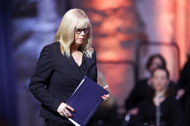 Magdeburg's Mayor Simone Borris leaves the lectern after delivering a speech during a commemorative ceremony at St John's Church (Johanniskirche) one year after a deadly SUV rampage in which six people were killed and more than 300 wounded at the Christmas market at the Old market square in Magdeburg, eastern Germany, on December 20, 2025. (Photo by Ronny HARTMANN / AFP)