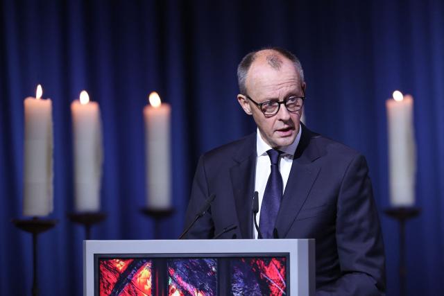 German Chancellor Friedrich Merz speaks at a commemorative ceremony at St John's Church (Johanniskirche) one year after a deadly SUV rampage in which six people were killed and more than 300 wounded at the Christmas market at the Old market square in Magdeburg, eastern Germany, on December 20, 2025. (Photo by Ronny HARTMANN / AFP)