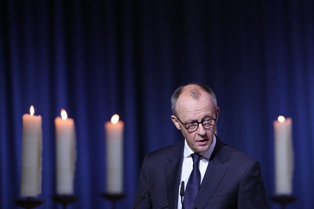 German Chancellor Friedrich Merz speaks at a commemorative ceremony at St John's Church (Johanniskirche) one year after a deadly SUV rampage in which six people were killed and more than 300 wounded at the Christmas market at the Old market square in Magdeburg, eastern Germany, on December 20, 2025. (Photo by Ronny HARTMANN / AFP)