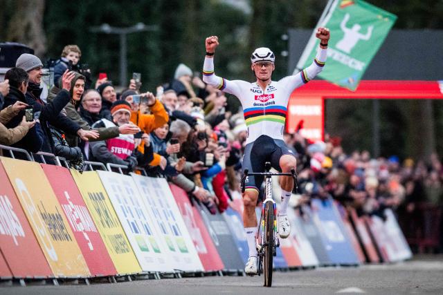Netherlands' Mathieu Van Der Poel celebrates as he crosses the finish line to win the men's elite race of the cyclo-cross World Cup, stage 5 out of 12 of the UCI World Cup competition, in Antwerp on December 20, 2025. (Photo by JASPER JACOBS / BELGA / AFP) / Belgium OUT
