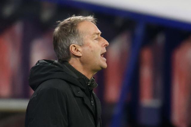 Bayer Leverkusen's Danish head coach Kasper Hjulmand reacts from the sidelines during the German first division Bundesliga football match between RB Leipzig and Bayer 04 Leverkusen in Leipzig, eastern Germany, on December 20, 2025. (Photo by Odd ANDERSEN / AFP) / DFL REGULATIONS PROHIBIT ANY USE OF PHOTOGRAPHS AS IMAGE SEQUENCES AND/OR QUASI-VIDEO