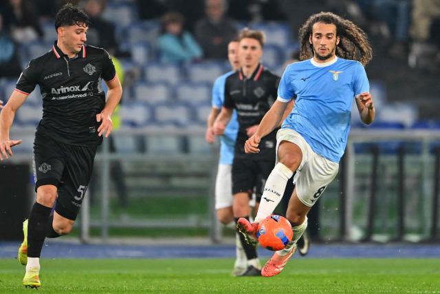 Lazio's French midfielder #08 Matteo Guendouzi (R) controls the ball during the Italian Serie A football match between Lazio and Cremonese at the Olympic Stadium in Rome on December 20, 2025. (Photo by Andreas SOLARO / AFP)