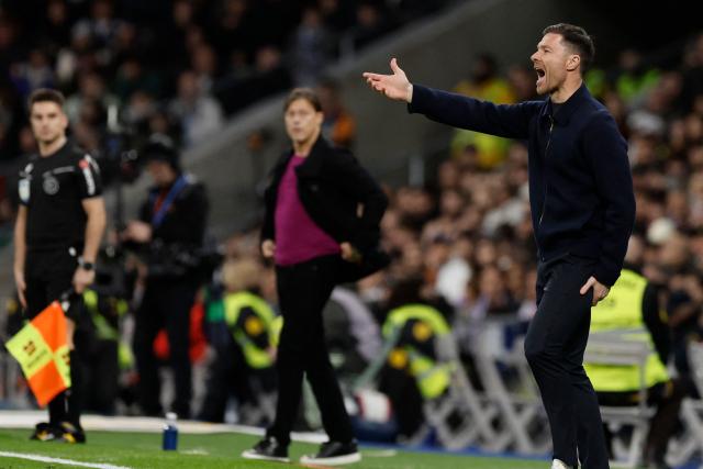 Real Madrid's Spanish coach Xabi Alonso reacts during the Spanish league football match between Real Madrid CF and Sevilla FC at Santiago Bernabeu Stadium in Madrid on December 20, 2025. (Photo by Oscar DEL POZO / AFP)