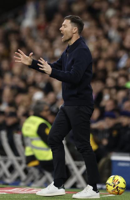 Real Madrid's Spanish coach Xabi Alonso reacts during the Spanish league football match between Real Madrid CF and Sevilla FC at Santiago Bernabeu Stadium in Madrid on December 20, 2025. (Photo by Oscar DEL POZO / AFP)