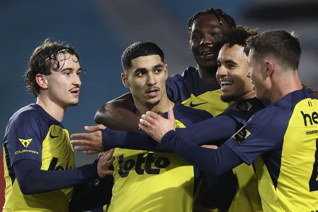 Union's Israeli forward #25 Anan Khalaili (2ndL) is congratulated by teammates after scoring a goal during the Belgian Pro League football match between Royale Union Saint-Gilloise and Zulte Waregem in Brussels, on December 20, 2025. (Photo by BRUNO FAHY / Belga / AFP) / Belgium OUT