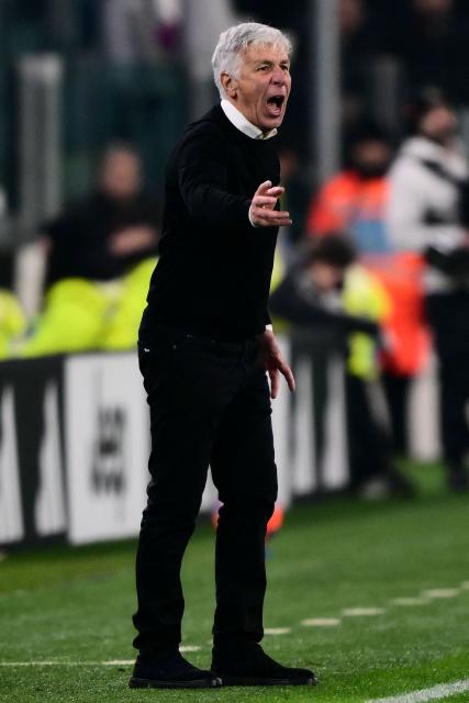 Roma's head coach Gian Piero Gasperini reacts in the techinal area during the Italian Serie A football match between Juventus and AS Roma at the Allianz stadium in Turin, northern Italy, on December 20, 2025. (Photo by MARCO BERTORELLO / AFP)