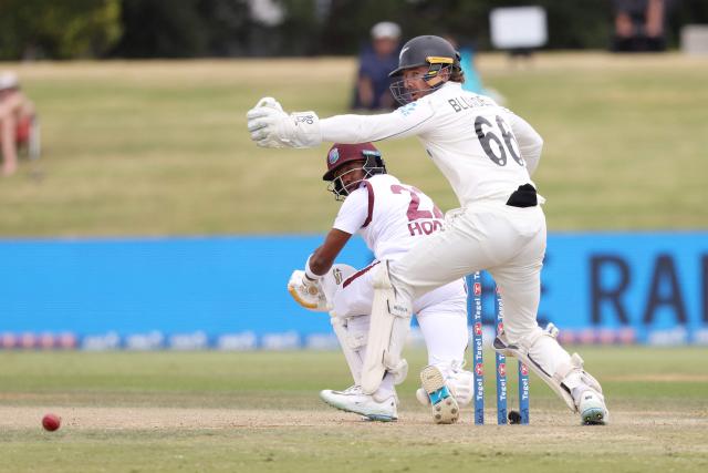 West Indies Kavem Hodge plays a shot past New Zealand’s Tom Blundell during day four of the 3rd international Test cricket match between New Zealand and West Indies at Bay Oval in Mount Maunganui, Tauranga, New Zealand on December 21, 2025. (Photo by Michael Bradley / AFP)