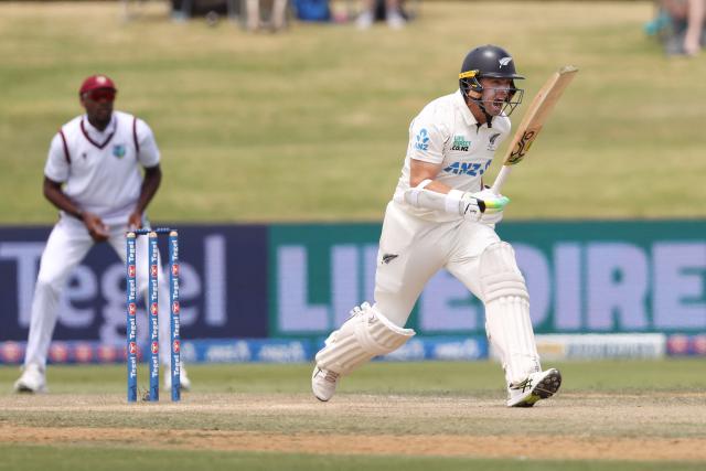 New Zealand’s Tom Latham makes a clear call during day four of the 3rd international Test cricket match between New Zealand and West Indies at Bay Oval in Mount Maunganui, Tauranga, New Zealand on December 21, 2025. (Photo by Michael Bradley / AFP)