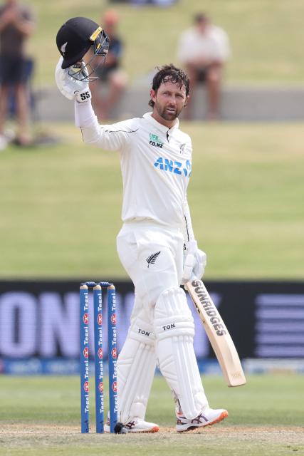 New Zealand’s Devon Conway celebrates his century during day four of the 3rd international Test cricket match between New Zealand and West Indies at Bay Oval in Mount Maunganui on December 21, 2025. (Photo by Michael Bradley / AFP)