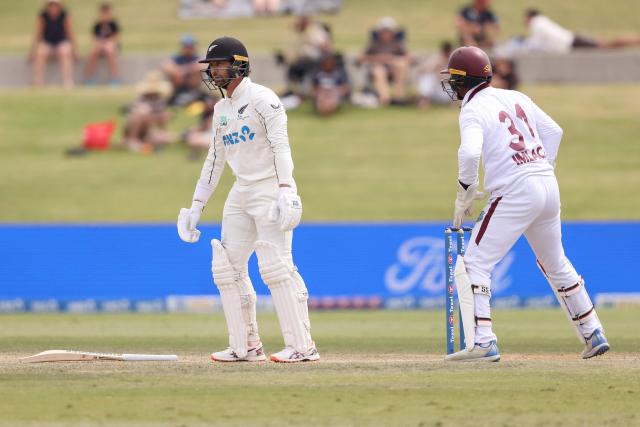 New Zealand’s Devon Conway (L) drops his bat during day four of the 3rd international Test cricket match between New Zealand and West Indies at Bay Oval in Mount Maunganui on December 21, 2025. (Photo by Michael Bradley / AFP)