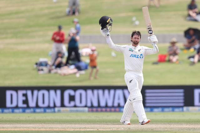 New Zealand’s Devon Conway celebrates his century during day four of the 3rd international Test cricket match between New Zealand and West Indies at Bay Oval in Mount Maunganui on December 21, 2025. (Photo by Michael Bradley / AFP)