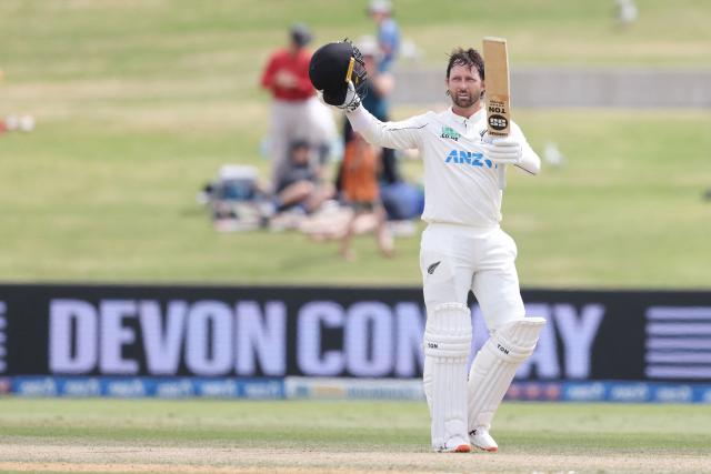 New Zealand’s Devon Conway celebrates his century during day four of the 3rd international Test cricket match between New Zealand and West Indies at Bay Oval in Mount Maunganui on December 21, 2025. (Photo by Michael Bradley / AFP)