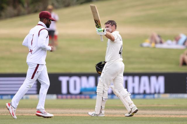 New Zealand’s Tom Latham celebrates his century during day four of the 3rd international Test cricket match between New Zealand and West Indies at Bay Oval in Mount Maunganui on December 21, 2025. (Photo by Michael Bradley / AFP)