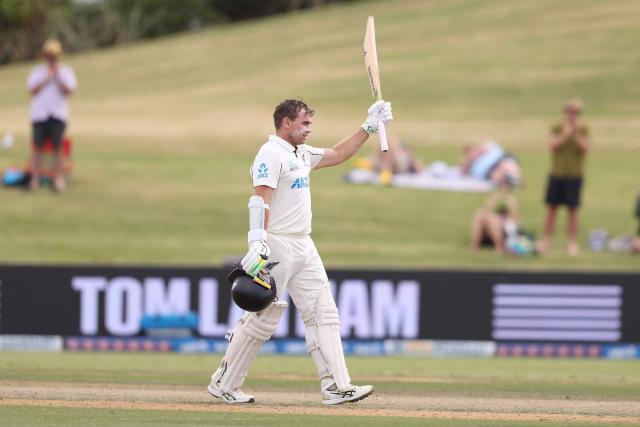 New Zealand’s Tom Latham celebrates his century during day four of the 3rd international Test cricket match between New Zealand and West Indies at Bay Oval in Mount Maunganui on December 21, 2025. (Photo by Michael Bradley / AFP)