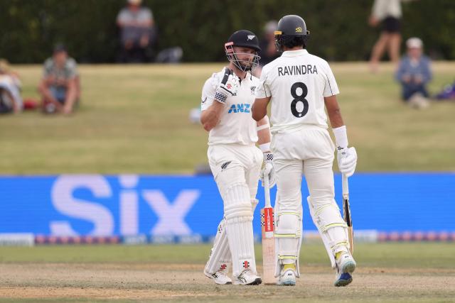 New Zealand’s Kane Williamson and Rachin Ravindra (R)  during day four of the 3rd international Test cricket match between New Zealand and West Indies at Bay Oval in Mount Maunganui on December 21, 2025. (Photo by Michael Bradley / AFP)